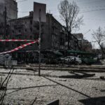 A devastated street in Kyiv showcasing war damage and destruction.